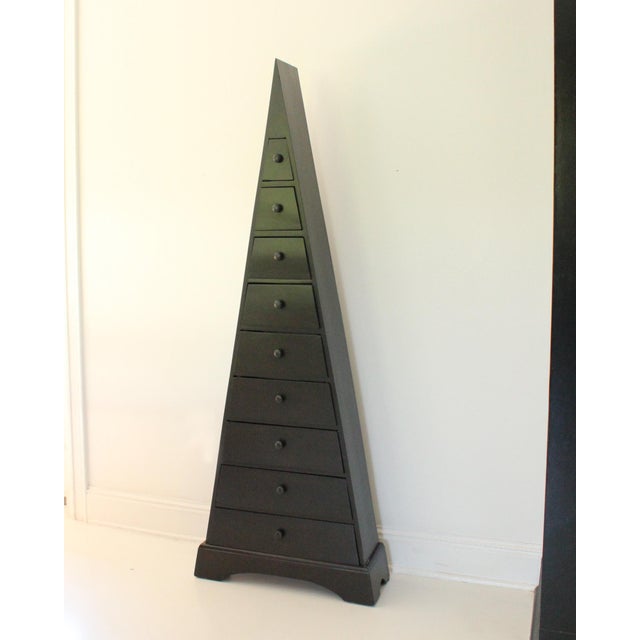 Vintage chest of 9 drawers with turned wood fixed pulls. Restored and recoated in a dark ebony stain, with a simple white...