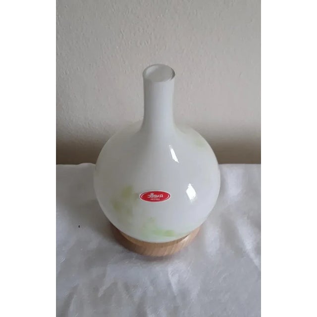 Vintage Bottle-Shaped Table Lamp in Colored Glass & Beech from Joska Kristall, 1990s, in Very Good conditions. Designed...