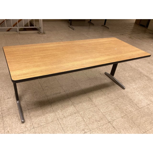 George Nelson “action office” table with aluminum feet in oak veneer, signed, manufactured by Herman Miller, circa 1970s.
