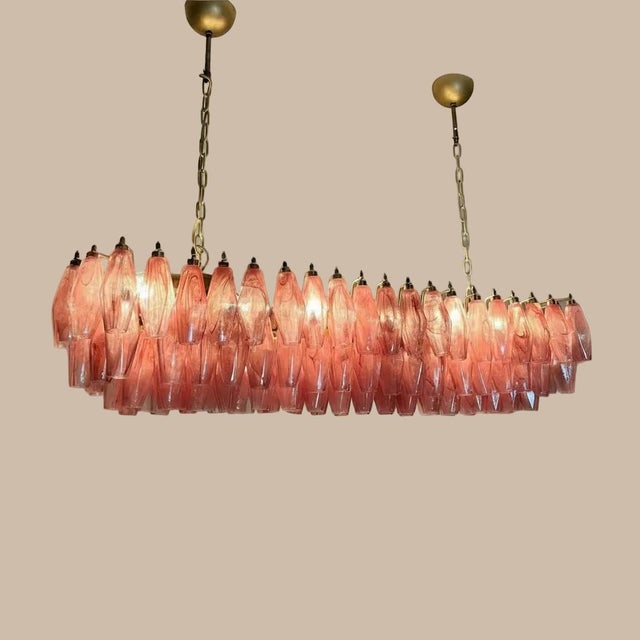 DUTIES FREE A striking and rare Italian chandelier composed of 138 exquisite Murano glass “poliedri” in a refined pink...