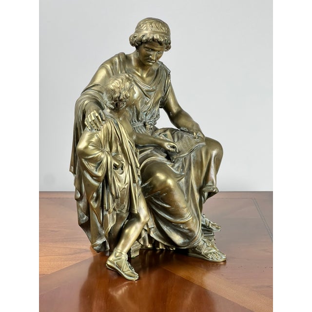 A compelling and deeply expressive 19th century bronze sculpture titled “Teacher and Pupil,” signed and dated 1865 by...