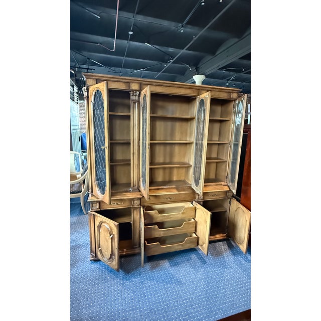 An exceptional breakfront china cabinet attributed to Karges Furniture, circa 1980s, showcasing the brand’s hallmark...