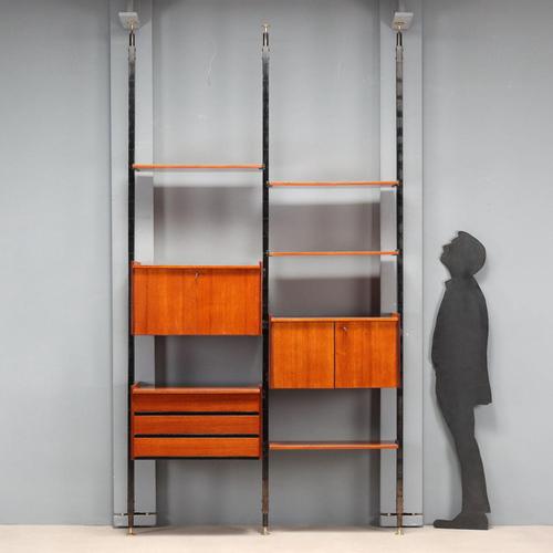 Vintage double-span bookcase, Italian-made from the 1960s, with black enameled metal uprights and brass end pieces....