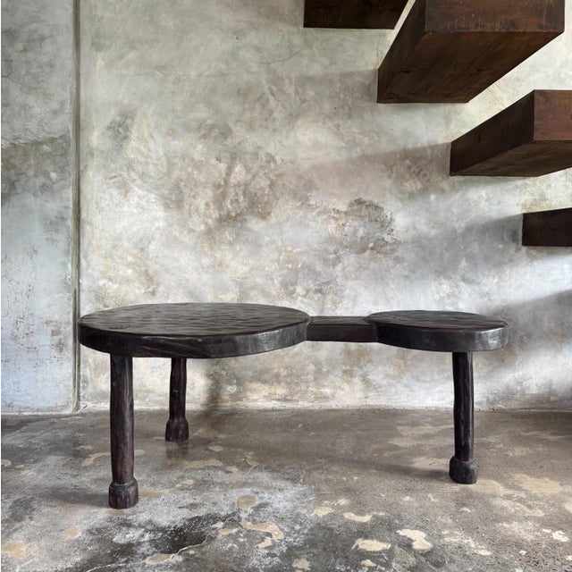 Large minimalist tripod coffee table in solid teak with two circular tiers. Dimensions: Length: 130.5cm; Diameter of the...