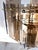 1970s brass/smoky glass pane 3-tiered chandelier. Excellent condition. Has been converted to a corded hardware mount for...