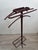 Iconic, chic, and luxurious valet stand by Jacques Adnet. France, 1950s. Tubular metal frame, entirely covered in saddle-...