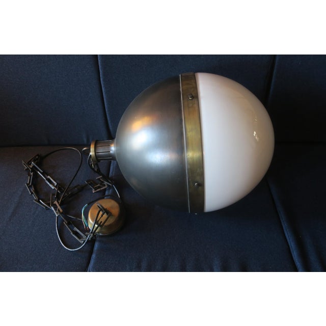 Large Hicks ball pendant light designed by Thomas O'Brien, New York, bronze with hand-rubbed antique brass and milk glass...