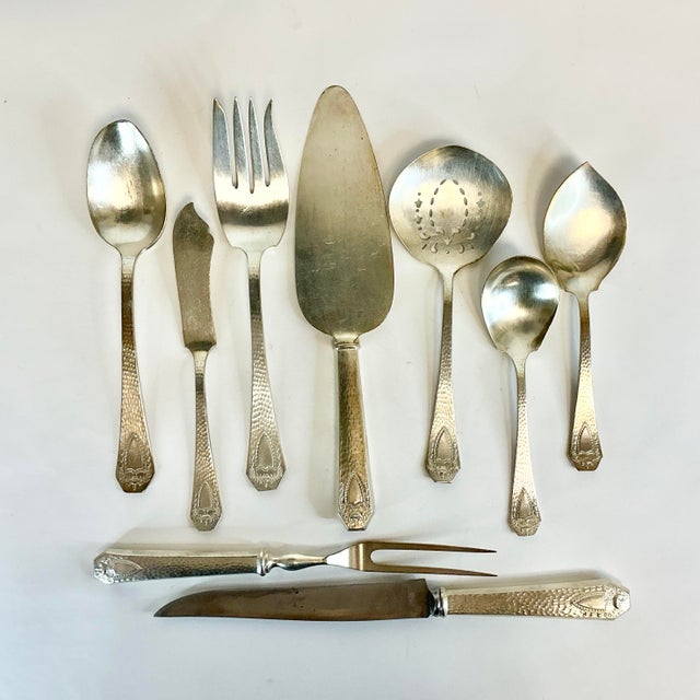 This is a wonderful set of 9 antique silver plate serving utensils. They are from the early 20th century from American...