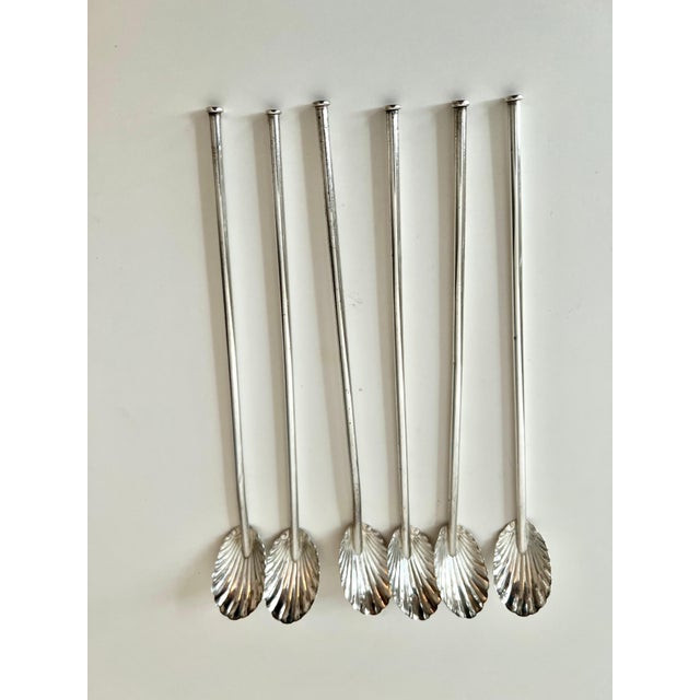 A handsome set of 6 sterling spoons with a scallop or clamshell style scoop. Very attractive addition to the bar or dining...