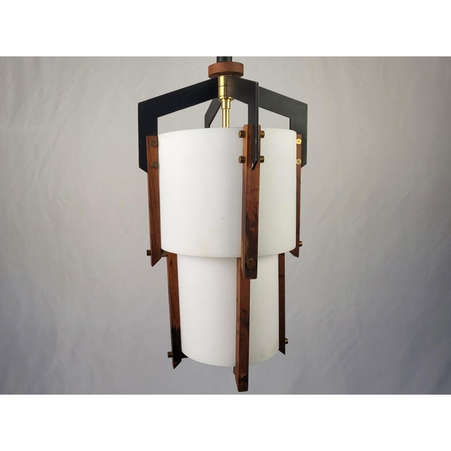 Dims.: 9" Diameter x 41"H Origin: Italy Circa: 1950's Black iron structure with central diffuser in white opal glass....