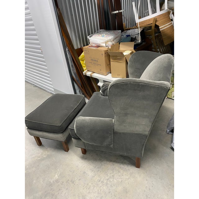 Newly upholstered wingback chair and ottoman with hardwood frame. Upholstered in a durable charcoal velvet. Ottoman is...