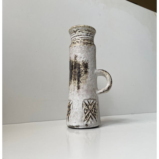 In the style of Jean Rivier and Jacques Blin in particular comes this magnificently glazed stoneware vase with a small...