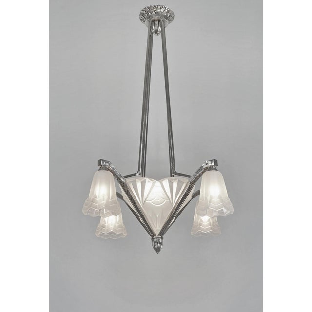 Degué A beautiful French 1930 art deco chandelier in nickel plated solid brass holding shades by Degué in frosted molded-...