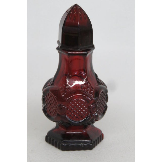 This lovely Ruby Red Salt / Pepper Shaker is made out of glass. This Single Shaker is stamped on the bottom as being made...