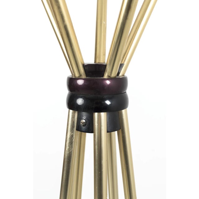 Beautiful vintage standing coat rack. The top of the coat rack can rotate and is made of gold/black-colored metal. The...