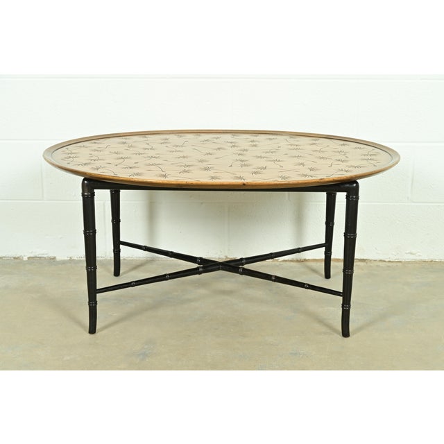 An exceptional mid-century modern Hollywood Regency coffee table or cocktail table By Kittinger USA, Circa 1950s Walnut...