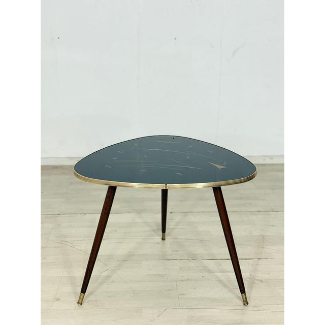 For sale is a very beautiful, charming vintage coffee table in very good condition. The top is made of glass. German...