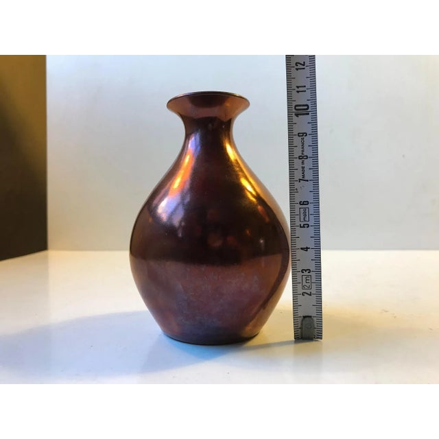 Small unique ceramic vase in copper/metallic lustre glaze. The vase is signed e. B. S. - klint. Precise attribution is...