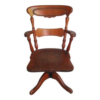 1920s Antique Sikes Co. Oak and Cast Iron Adjustable Swivel Rocker Chair with Carved Back For Sale
