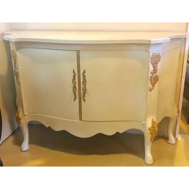 Louis XV style parcel-gilt and paint decorated two-door cabinet server sideboard.