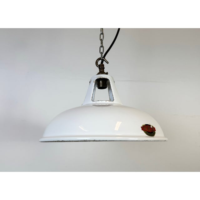 Industrial white enamel factory pendant light made by Thorlux in United Kingdom during the 1960s. White enamel inside the...