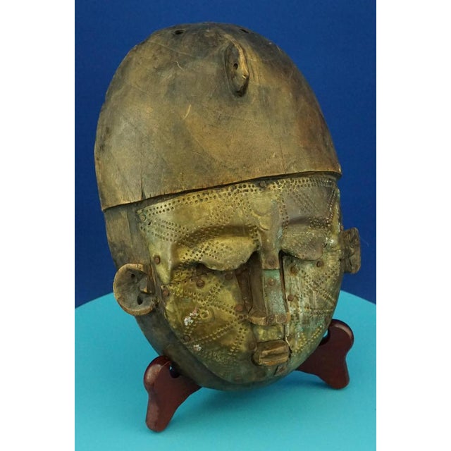 Item description: Wonderful ethnic sculpture, African tribal mask of a warrior, hand-carved from solid wood, covered in...