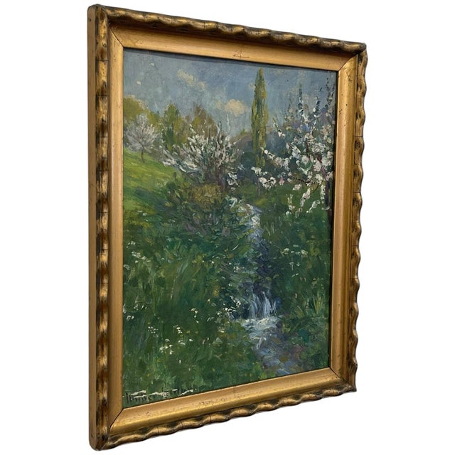 Vintage impressionist landscape painting depicting a flowering spring countryside scene with a winding stream running...