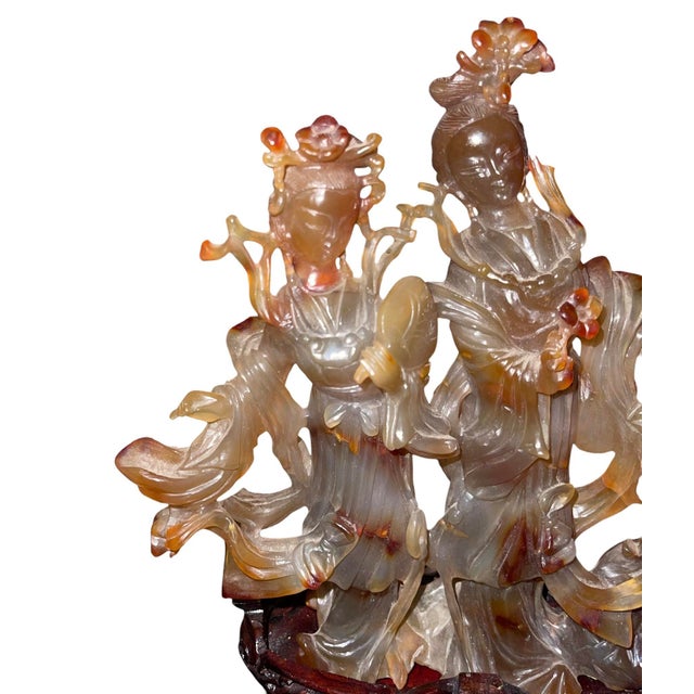 A finely carved Chinese carnelian agate sculpture depicting two graceful immortal maidens (仙女) standing in flowing...