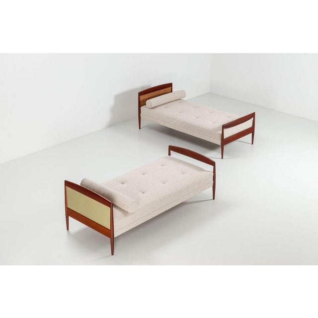 Beautiful and elegant Scandinavian daybeds, produced in Denmark in the 1960s. Crafted in warm-toned teak, the design is...