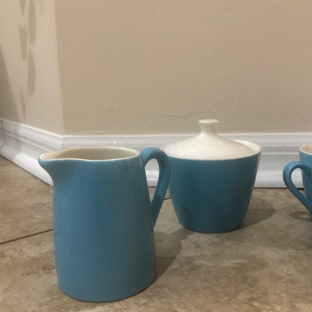 These vintage, sky blue Midcentury coffee cups, creamer, sugar, and fruit bowl are fabulous! The coffee cups are...