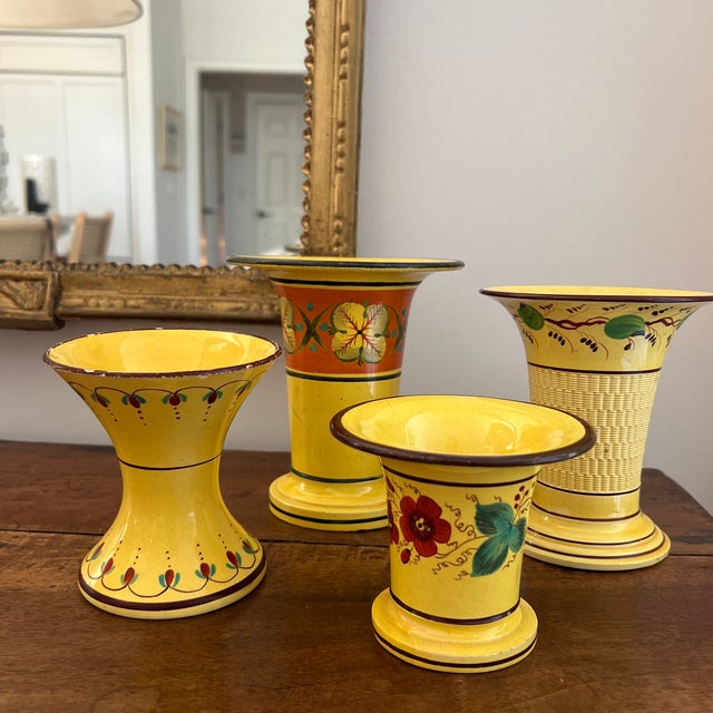 Stunning collection of four yellow ceramic vases- early 19th-century Staffordshire pottery spill vases, specifically...
