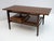 This coffee table was produced in the 1950s, the table has been restored and polished with shellac, the legs are made of...