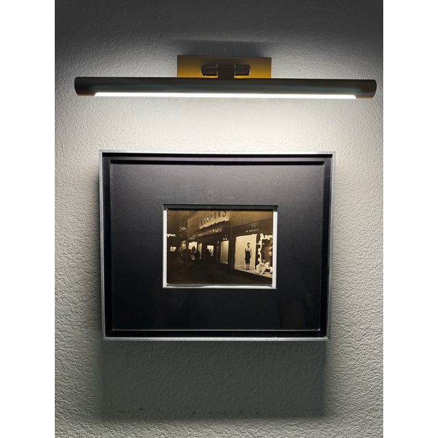 A striking original street photograph capturing the illuminated storefront of the famed Russeks department store in...