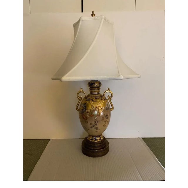 Stunning hand painted and gilt 19th Century Royal Crown Derby urn now as a lamp. The detailed painted urn with exotic...