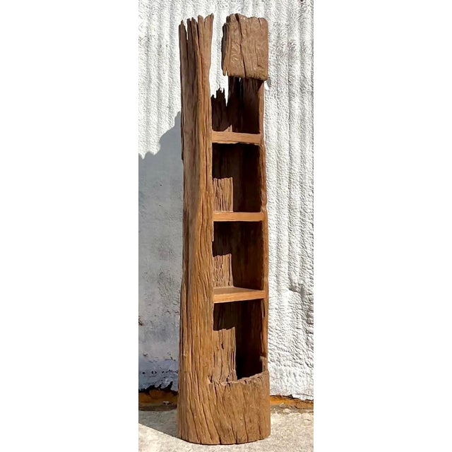 This remarkable vintage etagere, crafted from a beautifully carved tree trunk, embodies an authentic Boho aesthetic with a...
