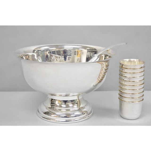 Vintage Sheridan Mid Century Modern Silver Plated Punch Bowl Set w/ 10 Stacking Cups and Ladle. Circa Mid 20th Century....