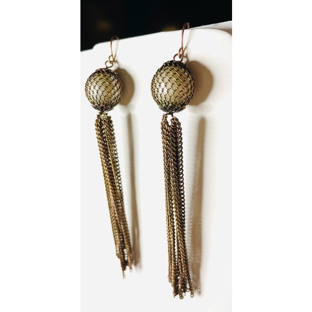 This is part of Chairish’s Costume Jewelry assortment. These earrings from the 1920s evoke the celebratory feel of the...