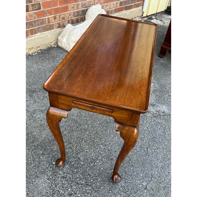 English mahogany tea table. Beautiful wood graining/toning with dished top, two extendable candle stands, and cabriole...