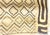 A rectangular hand woven raffia textile featuring intricate geometric embroidery and appliqué designs. Originating from...