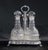 Gorgeous Vanberg silverplate three decanter bottle set. The bottles have been intricately crafted from cut glass with...