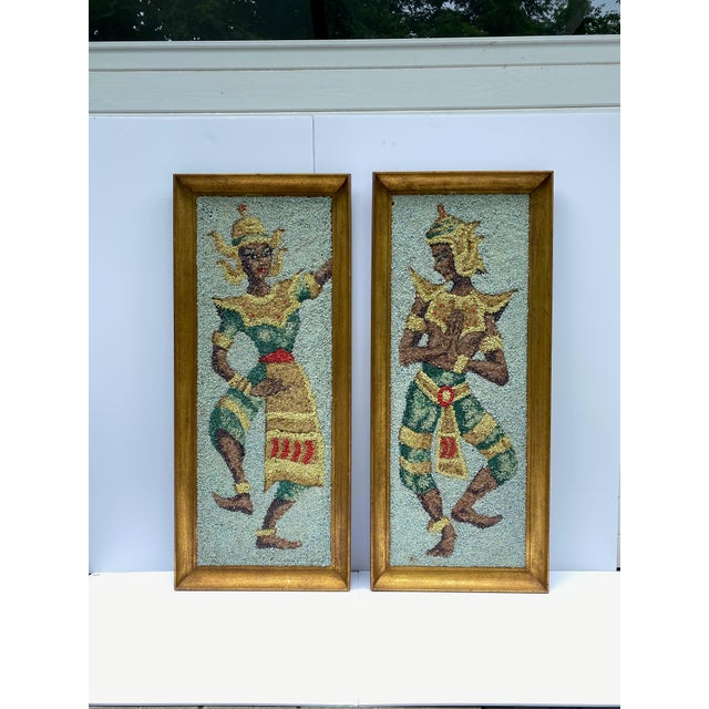 Amazing pair of Thai dancing figures in colorful pebble mosaic depicting colorful attire. Man and woman dancing in hues of...