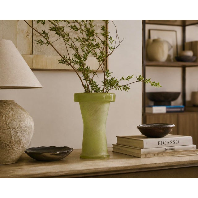 An exceptional mid-century art glass vessel distinguished by its architectural silhouette and richly textured...