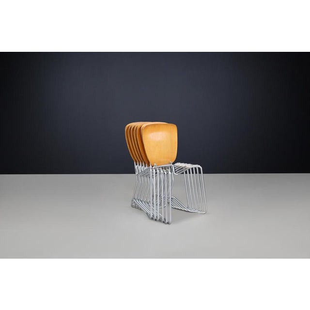 Stackable Aluflex chairs designed by Armin Wirth for Hans Zollinger Sohre in Switzerland in 1951. This set features six...