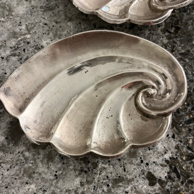 Pretty accent decor for coffee table, two sea shell motif sterling silver mini plates. Maker is unknown.