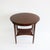 An oval Vienna Secession two-tier table from Austria circa 1905. Stained Beechwood standing on four tapered legs with...