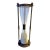 Solid Brass and Glass Classic Hour Glass With Sphere Finials and Feet For Sale