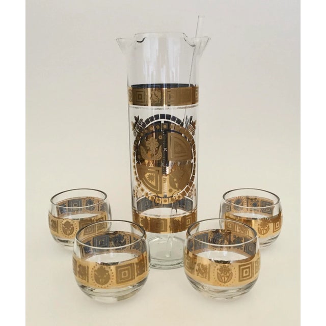 Culver Coronet has a gold crest design. Excellent condition. Signed Culver. Set includes pitcher, four roly poly glasses...
