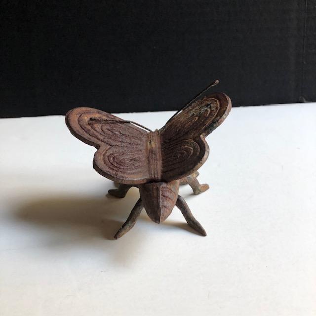 Sweet mid-century iron figurine in shape of butterfly. Use indoors or outdoors.