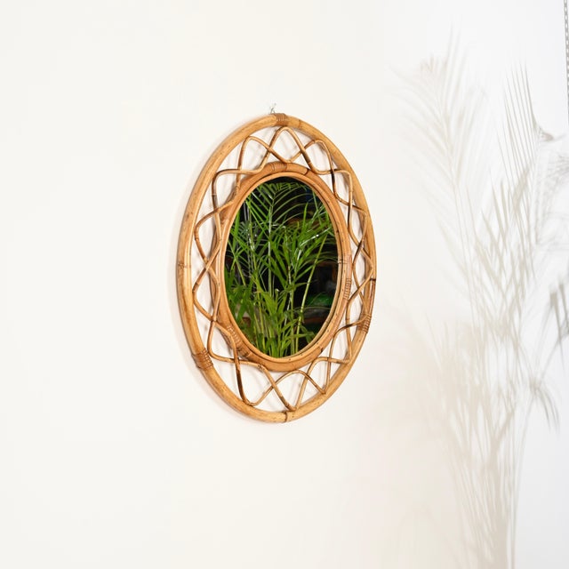 Stunning mid-century French Riviera style round mirror, entirely crafted from bamboo, rattan, and wicker. This charming...