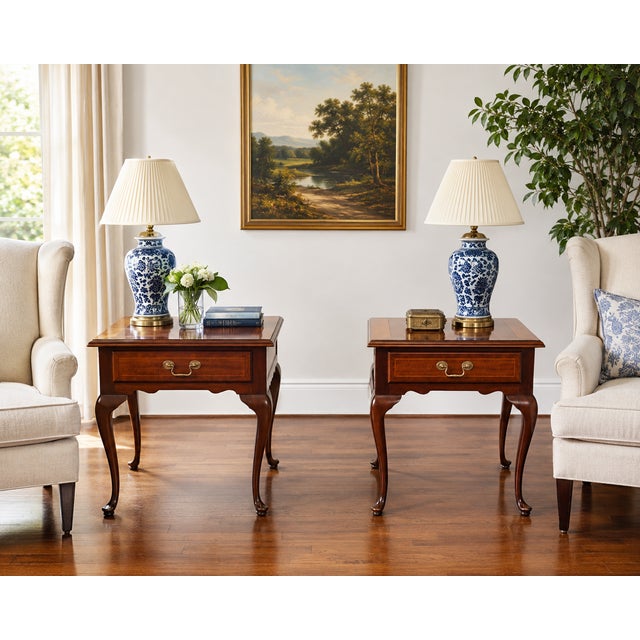 An elegant pair of mahogany lamp tables by Councill Craftsmen, showcasing the exceptional quality and traditional styling...